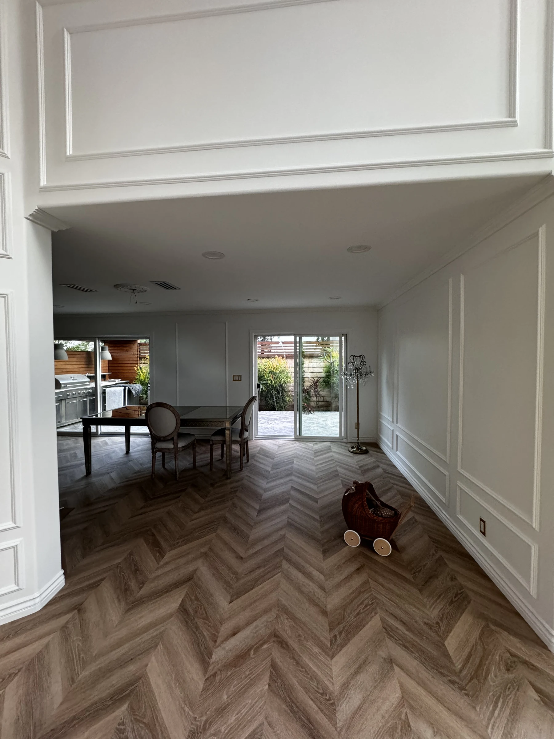 Dining room with a herringbone wood floor