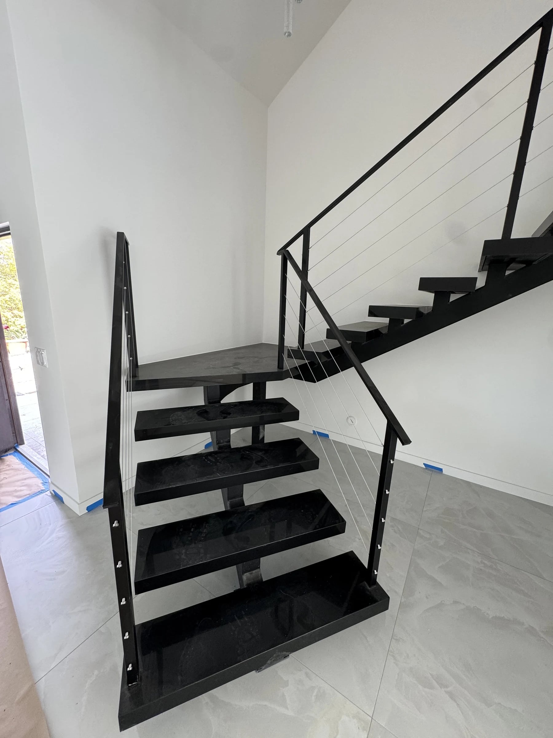Floating steel staircase with cable rail in Santa Monica